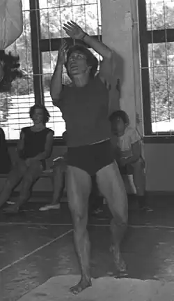 Gymnast Ágnes Keleti assisting another gymnast