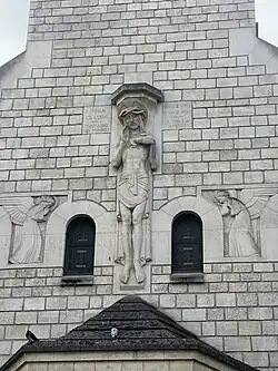 Sculpture of The Sacred Heart of Christ and Angels over the portal