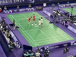 Ou with his partner Liu Yuchen after beating American pair Vinson Chiu and Joshua Yuan in the 2024 Summer Olympics