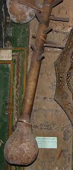 Vietnam. Đàn goong with tuning pegs for wire strings. Gourd on bottom. Goong means gong.