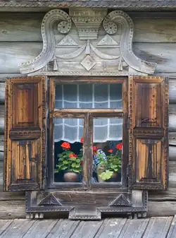 Window with shutters and carved volute platband, late 19th century
