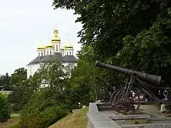 Cannon of 18th century on the shaft, with St. Catherine's Church in the background