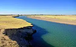 View of the Chu river at the edge of the desert