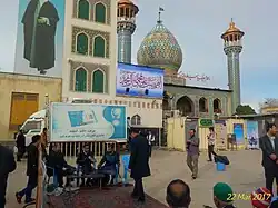 Waxing pilgrims' shoes by volunteer servants at the tomb of Sayyid Alauddin Hussein