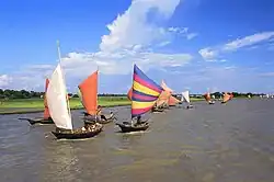 Boats with brightly coloured sails