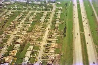 Aerial photograph of damage to a neighborhood