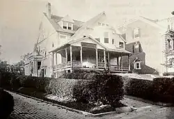 Photograph of a house and hedges