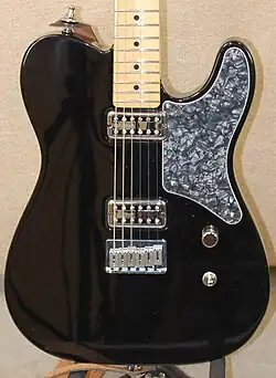 Closeup of Fender. Bridge replaced with American hardtail Stratocaster bridge.