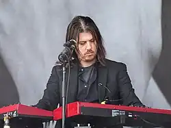Curtis performing with Interpol in 2015