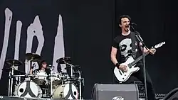 Joe Duplantier on guitar and Mario on drums onstage