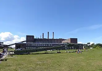 V1 rocket on launch ramp with power station behind, Peenemünde 23 07 2020