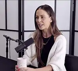 DeVille smiling at an industry event in 2021