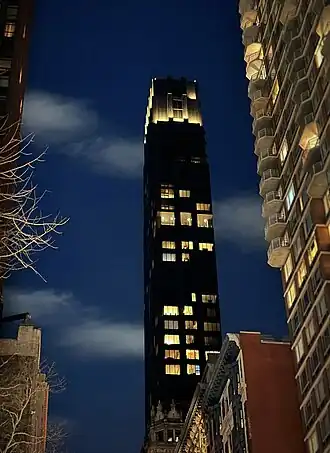 Facade of 30 East 29th Street uplit at night