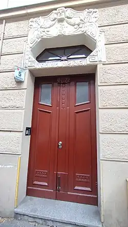 Decorated entrance door with BP initials