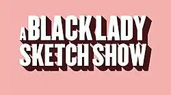 This is the title card for A Black Lady Sketch Show. The type is large and sans serif and the font color is white; the background is light pink and each letter has a drop shadow.