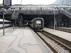 Outside stairways connecting the street level (upper deck) and the railway yard