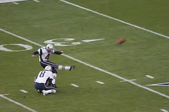 Adam Vinatieri warms up before the game