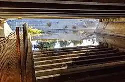 Under US Highway 101; during the dry season the underpass is used as a bicycle/pedestrian trail.