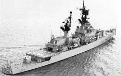 USS Belknap, a non-flush-deck ship, has the main deck giving way to a lower quarterdeck towards the stern