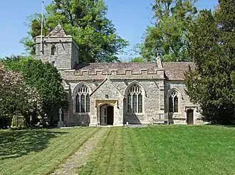 Stone building with small square tower.