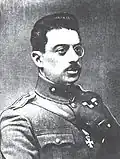 Colonel D. Ambelas, showing the usual way of wearing the Silver and Gold grades of the Cross of Valour on field uniforms, passed through the second buttonhole