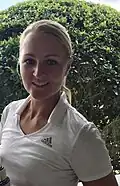 Pro golfer Anna Nordqvist wearing a johnny collar polo at an LPGA tournament