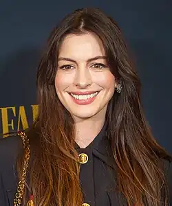 A head shot of Anne Hathaway as she poses for the camera