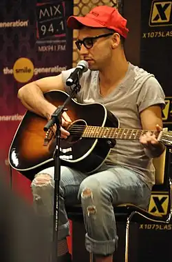 Jack Antonoff on a guitar