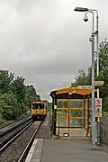 A Merseyrail Class 507 approaches the station.