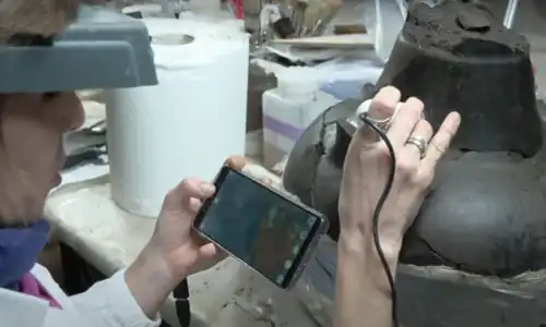 Archaeologist from the specialised company SAP working on a vase found at the site of Amorosi