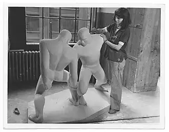 Josephine Frankel Levy working on her sculpture "The Wrestlers"