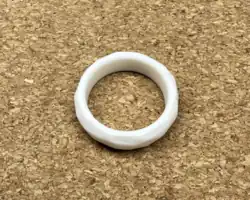 Aro ring, a white ring most commonly worn on the left middle finger