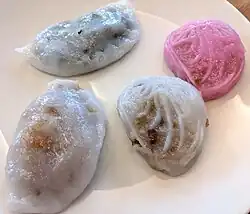 A selection of Teochew-style kueh. Clockwise from top left, two png kueh in pink and white, soon kueh and ku chai kueh.