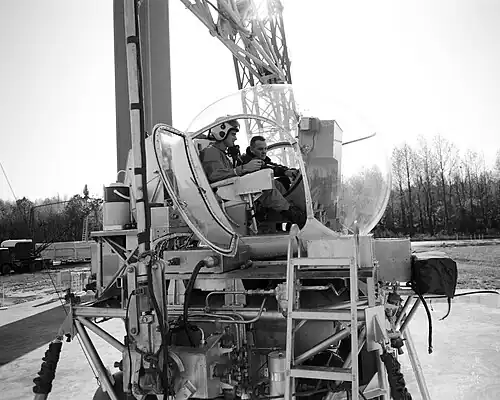 Astronaut Roger B. Chaffee (left) receives instruction from Maxwell W. Goode, a scientist at NASA's Langley Research Center