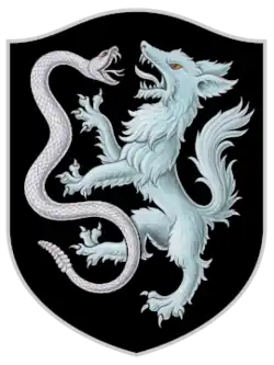 A black crest depicting a snake and wolf fighting