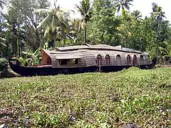 Houseboat in the midst of weeds in the backwaters