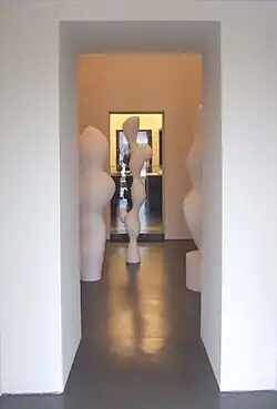 View from outside into the basement with works by Hans Arp