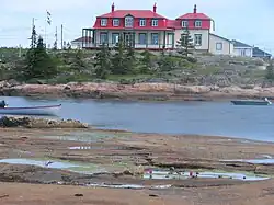Johan Beetz House (Le Chateau),[2] Piashti River, rock of Canadian Shield
