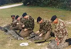 Royal Bermuda Regiment recruits in 1993 wearing green lightweight trousers, green shirts and sweaters, with 1968 Pattern DPM combat jackets, berets, and DMS high-boots and equipped with 1958 Pattern carrying equipment