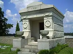 Mausoleum with "1912" and "ROSENBAUM" inscribed on the top and two chalices flanking the entrance