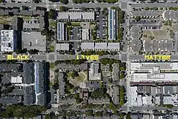 Aerial shot of three city blocks. The words "black," "lives," and "matter" are in all capitol letters, one word on the street per block.