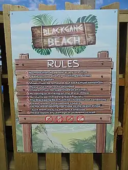 Sign giving rules for the attraction e.g. socks but no shoes, no stunts, children must be supervised, closed in wet conditions