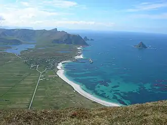 The village of Bleik in Andøy, with the long beach and a sea bird colony on the small island Bleiksøya. The deep ocean is very close to shore here, and sperm whales feed in this area.