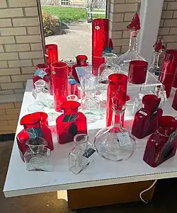 various types of glassware in red and clear crystal