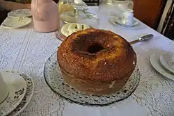 A full bolo de fubá on a table
