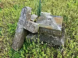 Broken cross sculpture