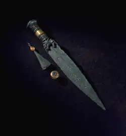 Dagger, tweezers and button with gold decoration, Sweden.