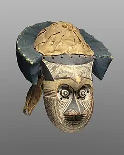Pwoom Itok mask; late 19th century; 39.1 x 28.6 x 29.8&nbsp;cm (153⁄8 x 111⁄4 x 113⁄4 in.); Brooklyn Museum (USA). This mask may have represented a wise older man at boys' initiations. One of the principal Kuba dance masks is called pwoom itok. The chief identifying characteristic is the shape of the eyes, whose centers are cones surrounded by holes through which the wearer sees.