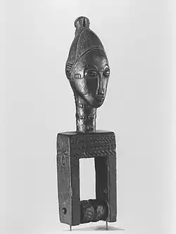 Heddle pulley with female head; late 19th or early 20th century; wood; 20.6 × 5.4 × 4.8&nbsp;cm (81⁄8 × 21⁄8 × 17⁄8 in); Brooklyn Museum