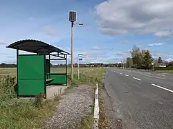 An image of a bus stop in Oara village